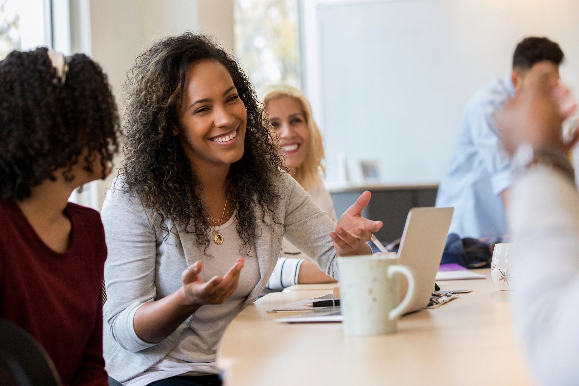 Co-workers laugh together